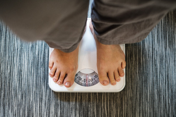 a man standing on a weight machine