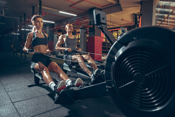 a man and a woman working out in the gym